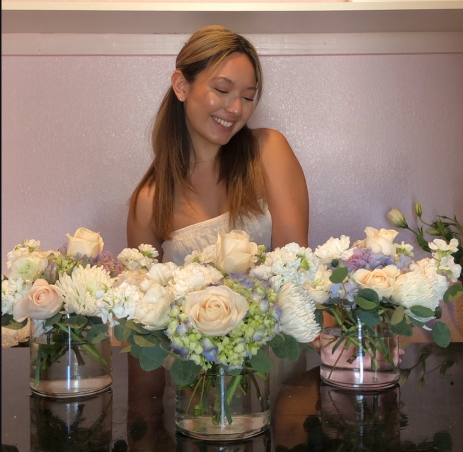 Florist holding a custom flower arrangement